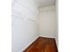 Walk-in closet featuring wire shelves and hardwood floors at 4066 Harvest Ridge Dr, Douglasville, GA 30135
