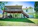 Backyard with a screened-in porch, wooden staircase and mature trees at 4066 Harvest Ridge Dr, Douglasville, GA 30135