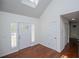 Bright foyer with beautiful hardwood floors, a skylight, and a glimpse into other rooms at 4066 Harvest Ridge Dr, Douglasville, GA 30135