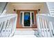 Close-up of the home's front entrance, framed by brick and white railings at 4066 Harvest Ridge Dr, Douglasville, GA 30135