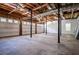 Spacious garage features three white garage doors, concrete floors, and exposed utilities at 4066 Harvest Ridge Dr, Douglasville, GA 30135