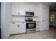 Modern kitchen with stainless steel appliances, white cabinets, and light-colored countertops at 4066 Harvest Ridge Dr, Douglasville, GA 30135
