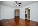 Spacious living area featuring gleaming hardwood floors, white walls, and ample natural light at 4066 Harvest Ridge Dr, Douglasville, GA 30135
