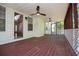 Spacious screened porch with a wood deck, ceiling fans, and views of the backyard at 4066 Harvest Ridge Dr, Douglasville, GA 30135