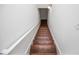 Wooden staircase with white handrail leading to the next level at 4066 Harvest Ridge Dr, Douglasville, GA 30135