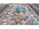 Community aerial view featuring a pool, tennis courts, playground and neighborhood at 5525 Nesmith Ct, Cumming, GA 30040