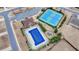 Aerial view showcasing the community pool, tennis courts, playground, and parking area for residents to enjoy at 5525 Nesmith Ct, Cumming, GA 30040