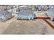 Large backyard featuring a well-kept lawn, a patio for outdoor seating, and space for various activities at 5525 Nesmith Ct, Cumming, GA 30040
