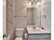 Bathroom featuring a marble tiled shower and modern fixtures at 5525 Nesmith Ct, Cumming, GA 30040