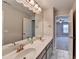 Double vanity with marble floors and paint in spacious bathroom at 5525 Nesmith Ct, Cumming, GA 30040