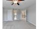 Spacious bedroom featuring a ceiling fan and neutral color palette at 5525 Nesmith Ct, Cumming, GA 30040