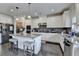 Bright kitchen featuring granite countertops, a center island with seating, and modern stainless steel appliances at 5525 Nesmith Ct, Cumming, GA 30040