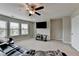 Spacious living room features a ceiling fan and great natural light at 5525 Nesmith Ct, Cumming, GA 30040