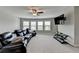 Spacious living room features a ceiling fan and great natural light at 5525 Nesmith Ct, Cumming, GA 30040