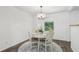 Intimate dining nook with natural light, simple decor, and comfortable seating for casual meals at 151 John Christopher Dr, Alpharetta, GA 30009