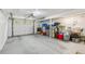 Spacious garage area provides ample room for parking and storage with clean painted walls and floor at 151 John Christopher Dr, Alpharetta, GA 30009
