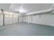 Cleaned-out two car garage with epoxy floor and painted walls at 151 John Christopher Dr, Alpharetta, GA 30009