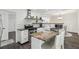 Well-equipped kitchen with granite countertops, modern appliances, and an island with seating at 151 John Christopher Dr, Alpharetta, GA 30009