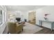 Open-concept living room with hardwood floors, fireplace, and natural lighting at 151 John Christopher Dr, Alpharetta, GA 30009