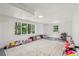 Bright living room with plush carpeting and lots of stuffed animals at 151 John Christopher Dr, Alpharetta, GA 30009