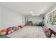 Living room featuring plush carpeting and lined with toys at 151 John Christopher Dr, Alpharetta, GA 30009