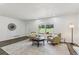 Inviting living room with neutral decor, and hardwood flooring throughout at 151 John Christopher Dr, Alpharetta, GA 30009
