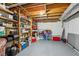 Basement storage area with organized shelving, an unfinished ceiling and concrete walls at 151 John Christopher Dr, Alpharetta, GA 30009