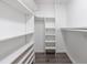 Organized walk-in closet with built-in shelving and ample room to store clothing at 151 John Christopher Dr, Alpharetta, GA 30009