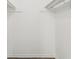 Spacious walk-in closet with ample hanging and shelving storage at 151 John Christopher Dr, Alpharetta, GA 30009