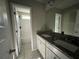 Bright bathroom with double sinks, granite countertops, and a shower/tub combo at 231 Creek View Pl, Canton, GA 30114
