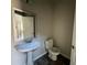 Half-bathroom with pedestal sink and dark wood floors at 231 Creek View Pl, Canton, GA 30114