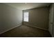 Cozy bedroom featuring carpet flooring, a window letting in natural light, and neutral colored walls at 231 Creek View Pl, Canton, GA 30114