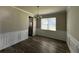 Elegant dining room featuring chair rail, chandelier lighting, and wood flooring at 231 Creek View Pl, Canton, GA 30114