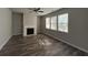 Bright living room with a fireplace, and three large windows at 231 Creek View Pl, Canton, GA 30114