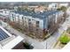 Aerial view of apartment building showcasing surrounding cityscape and mature trees at 2630 Talley St # 319, Decatur, GA 30030