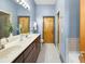 Bathroom features a double sink vanity, large mirror, and a separate shower at 2630 Talley St # 319, Decatur, GA 30030