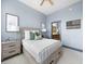 This cozy bedroom features a queen bed, neutral decor, and an ensuite bathroom at 2630 Talley St # 319, Decatur, GA 30030