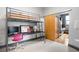 This multi-purpose room includes a lofted bed, desk, and access to the kitchen at 2630 Talley St # 319, Decatur, GA 30030