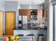 Stylish kitchen with stainless steel appliances, dark countertops, breakfast bar, and pendant lighting at 2630 Talley St # 319, Decatur, GA 30030