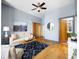 Living room with hardwood floors, ceiling fan, sofa, and access to the Primary bathroom at 2630 Talley St # 319, Decatur, GA 30030