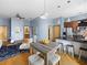 Open-concept living space with stainless steel appliances, hardwood floors, and comfortable seating at 2630 Talley St # 319, Decatur, GA 30030