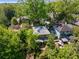 Aerial view showing the surrounding lush greenery, mature trees, and backyard patio at 374 8Th Ne St, Atlanta, GA 30309