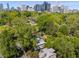 Aerial view of the property with green space, landscaping and city skyline in the distance at 374 8Th Ne St, Atlanta, GA 30309