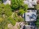 Aerial view of the property, showcasing the manicured backyard, landscaping, and roof at 374 8Th Ne St, Atlanta, GA 30309