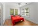 Bright bedroom featuring hardwood floors, two windows, and a ceiling fan at 374 8Th Ne St, Atlanta, GA 30309