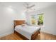 Comfortable bedroom with hardwood floors, ceiling fan, and natural light from large windows at 374 8Th Ne St, Atlanta, GA 30309