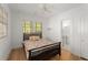 Bright bedroom with hardwood floors, two windows, and an ensuite bathroom at 374 8Th Ne St, Atlanta, GA 30309