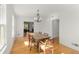 Classic dining room with hardwood floors, traditional chandelier, and ample natural light at 374 8Th Ne St, Atlanta, GA 30309