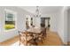Spacious dining room featuring hardwood floors, large windows, and classic chandelier at 374 8Th Ne St, Atlanta, GA 30309