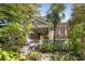 Charming two-story home with green siding, landscaped yard, and inviting front porch at 374 8Th Ne St, Atlanta, GA 30309